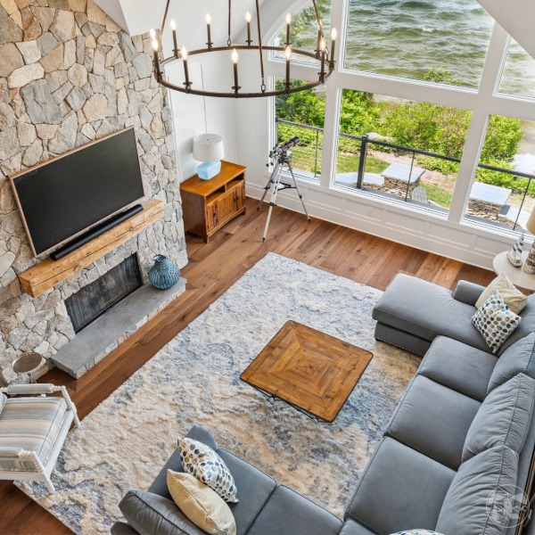 Curved eyebrow windows bring light and style to the Lakeside Legacy luxury home renovation in NH